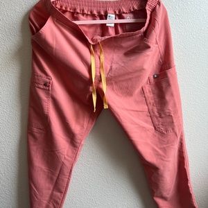 FIGS Women’s Yola Skinny - Petite Medium in color CORAL